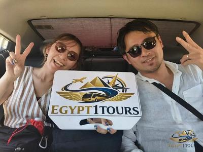 Travelers enjoying a comfortable air-conditioned ride inside Egypt 1 Tours private transfer vehicle