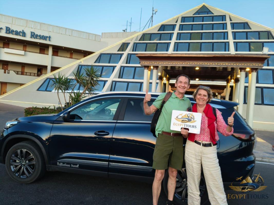Private car transfer from Aswan to Luxor with Egypt 1 Tours driver and travelers at hotel pickup