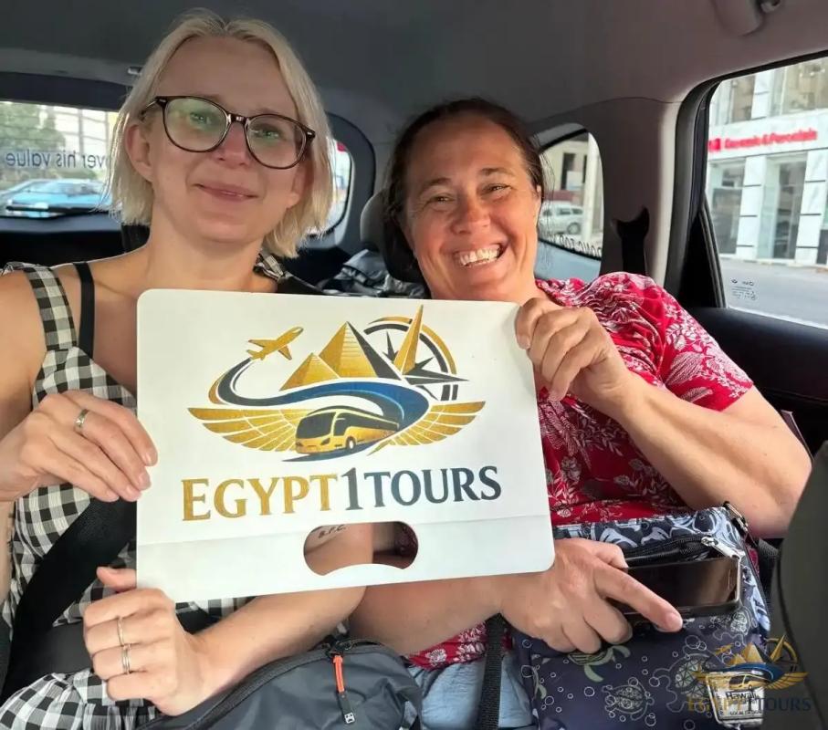 Travelers enjoying a comfortable air-conditioned ride inside Egypt 1 Tours transfer vehicle