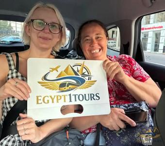 Travelers enjoying a comfortable air-conditioned ride inside Egypt 1 Tours transfer vehicle